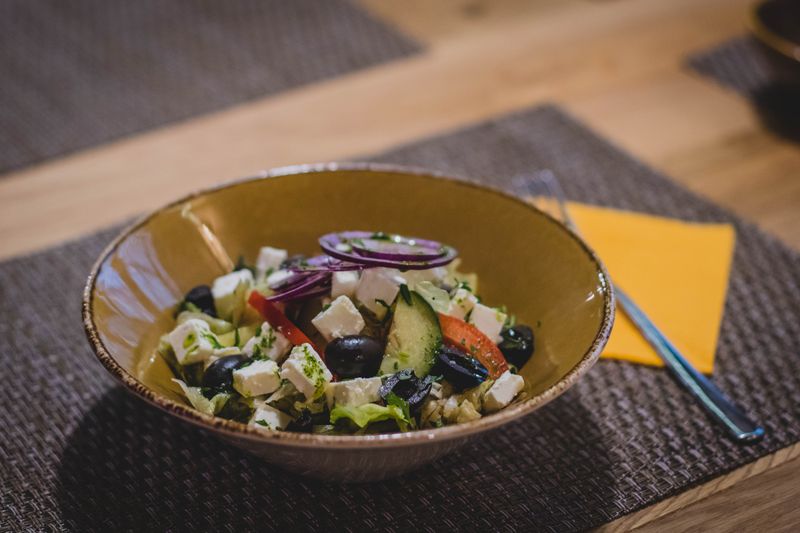 Greek garden salad with feta cheese, olives and fresh cucumbers